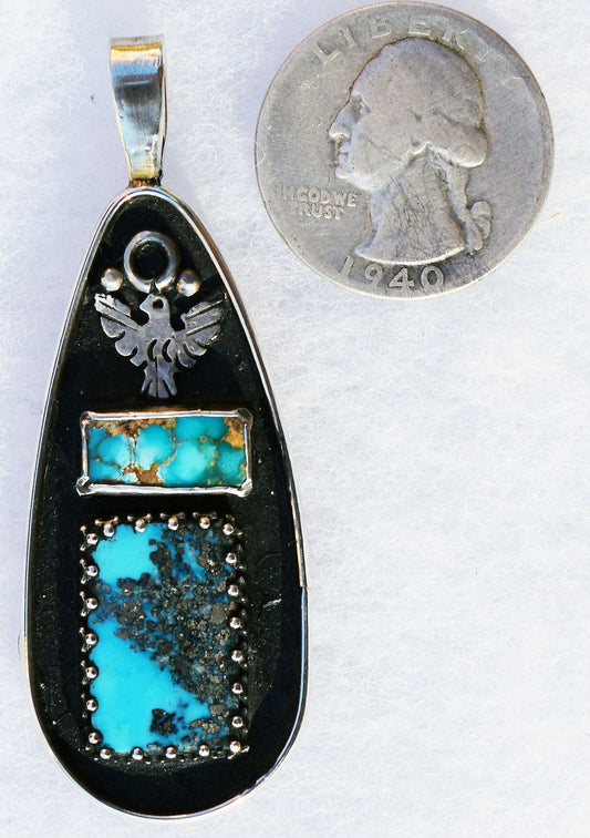 Persian Turquoise in a handmade sterling Silver pendant.