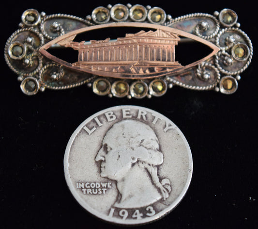 150 year old, sterling silver pin with marcasite and rose gold.