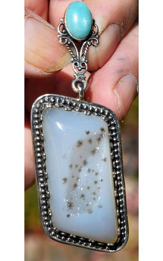 Tiny crystals and black snowflakes in a Sterling Silver pendant