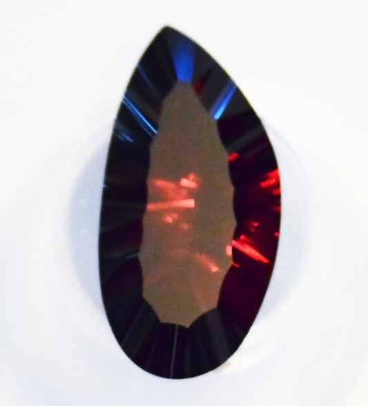 OH! WOW! One of the biggest (21.39 carats!) and most beautiful faceted Rhodolite Garnets you will ever see!