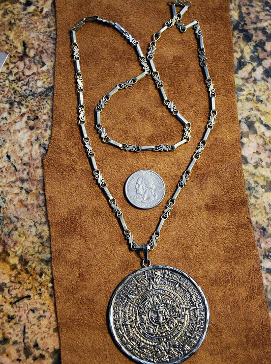 Double-sided Sterling Silver Mayan Calendar pendant on a 26 inch handmade ornate silver chain.