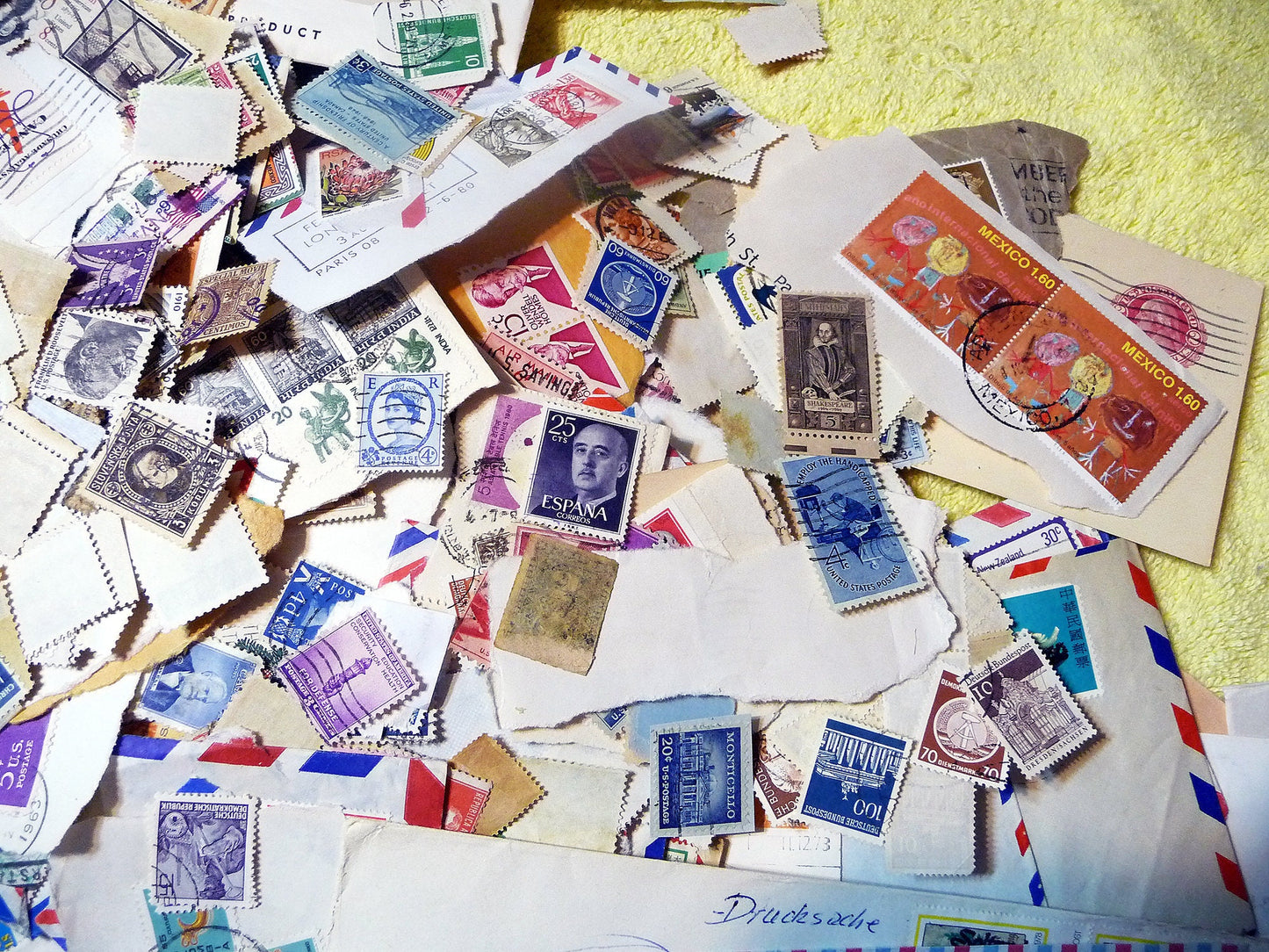 UNSEARCHED! Almost 1.5 pounds of US and world stamps dating from the mid 1800's through the mid 1970's!
