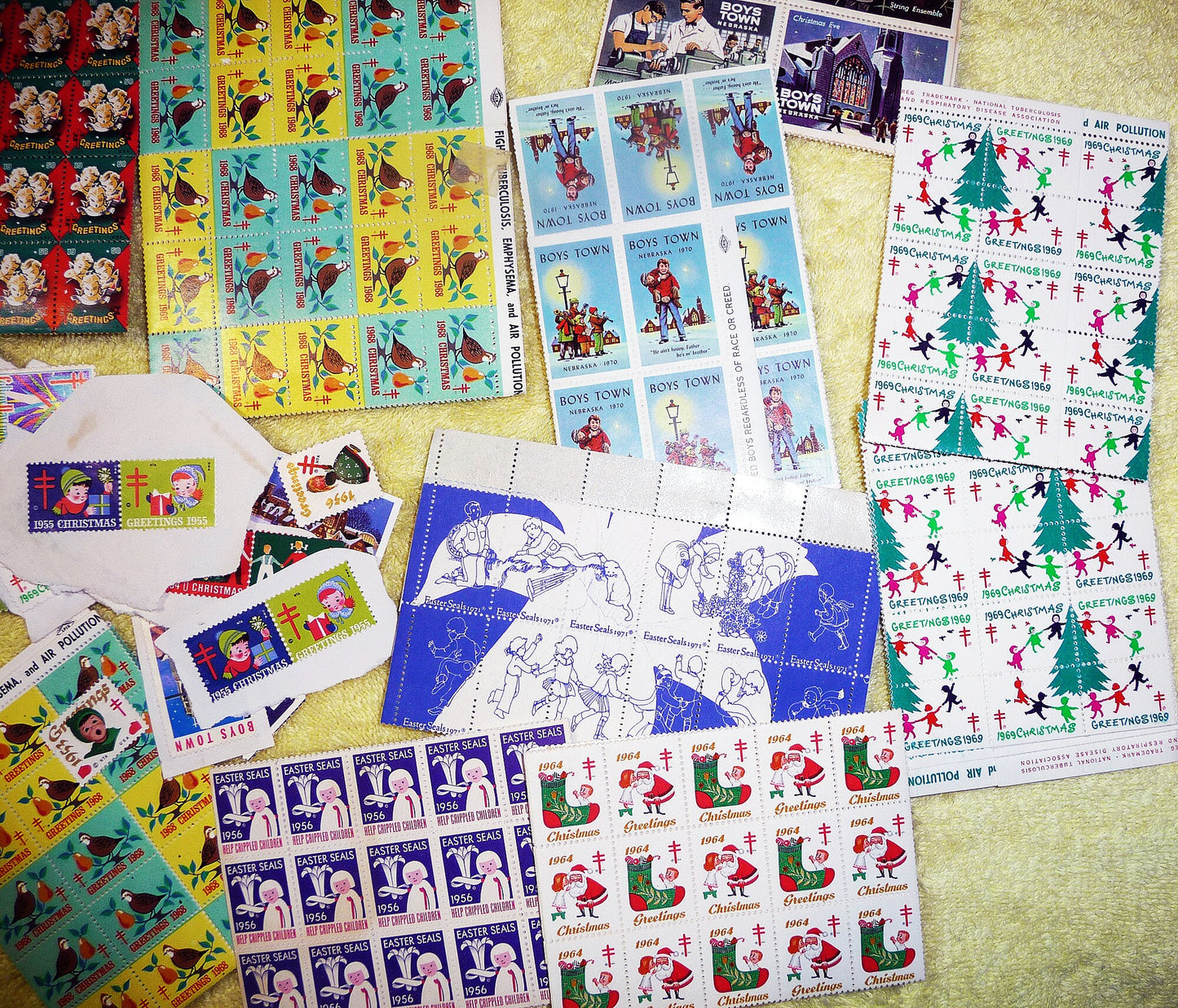 17 full sheets of 1960s and 1970s Christmas and Easter seals, Boy's Town seals, and featuring a sheet of 1966 NAACP Christmas seals!