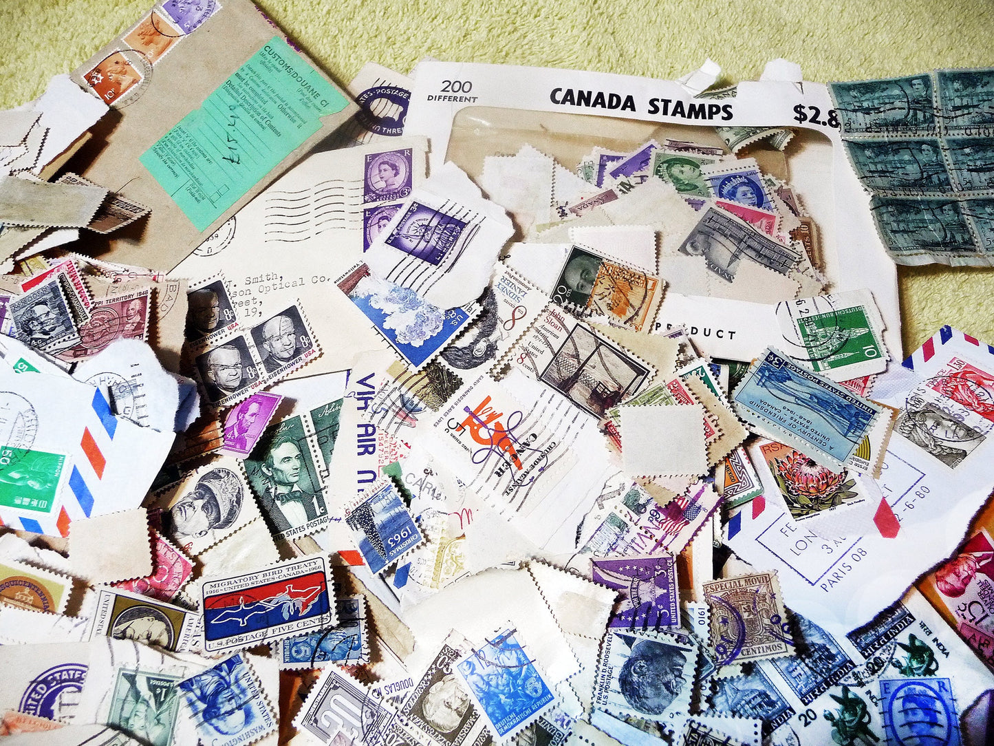 UNSEARCHED! Almost 1.5 pounds of US and world stamps dating from the mid 1800's through the mid 1970's!