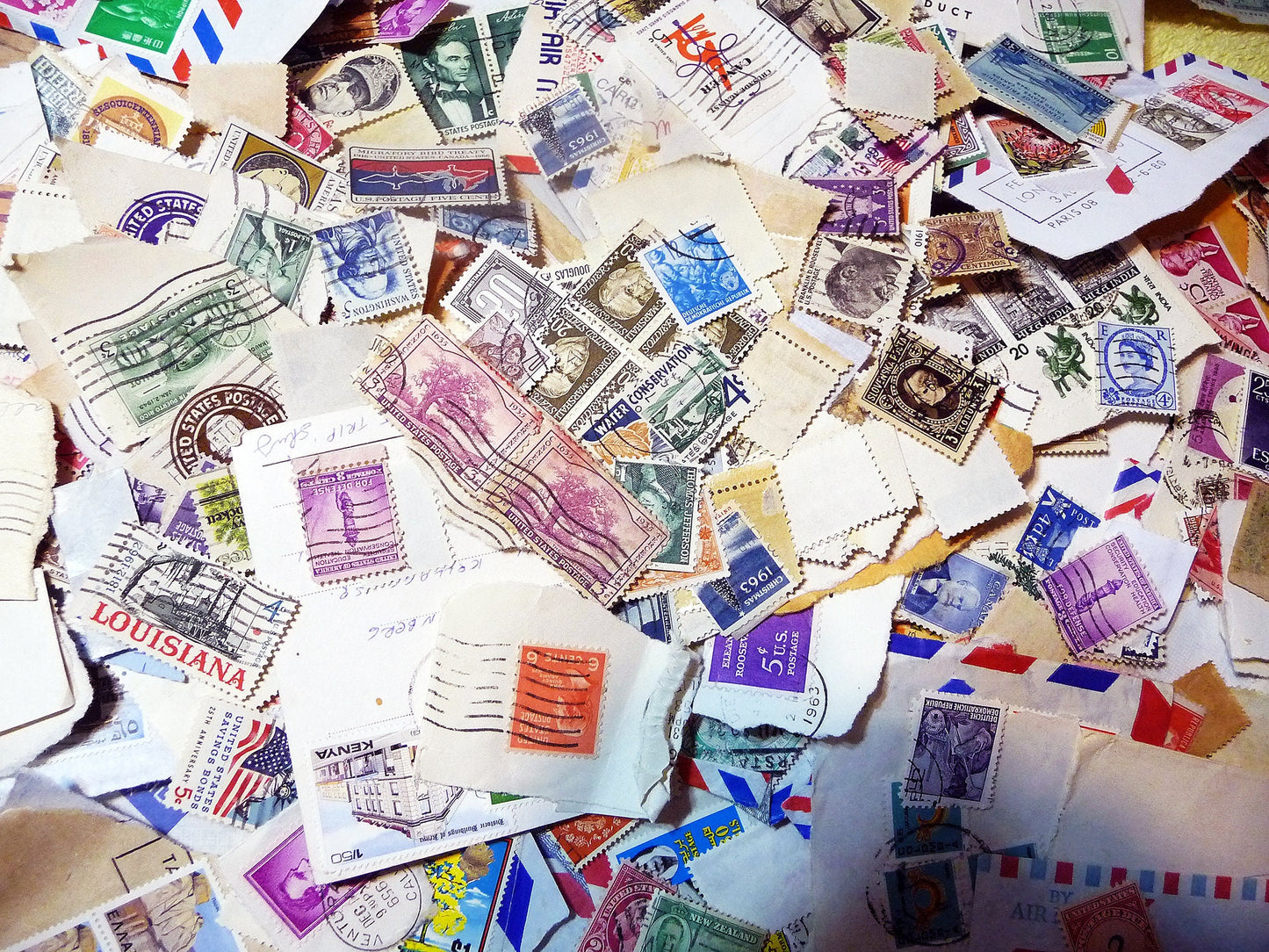 UNSEARCHED! Almost 1.5 pounds of US and world stamps dating from the mid 1800's through the mid 1970's!