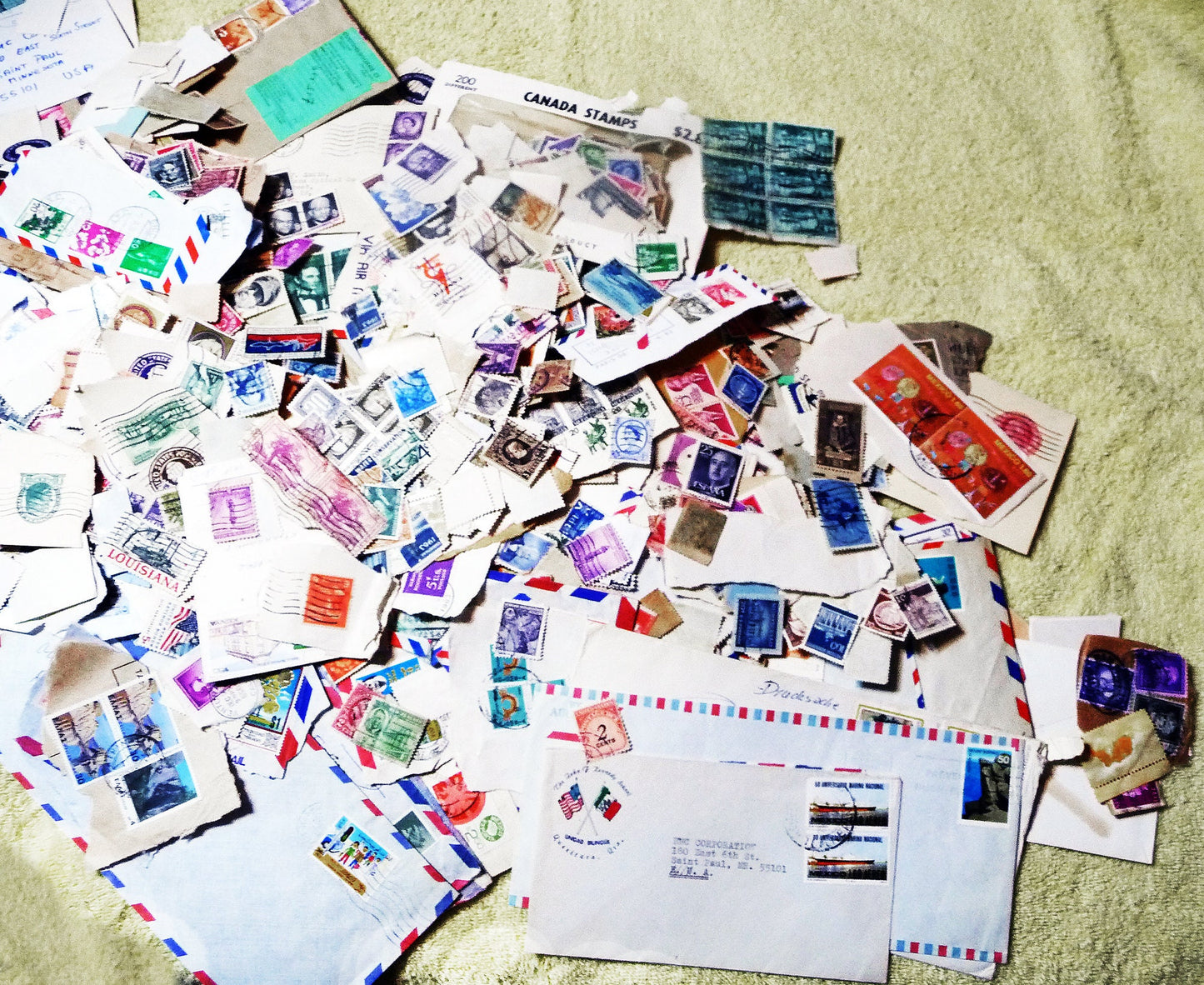 UNSEARCHED! Almost 1.5 pounds of US and world stamps dating from the mid 1800's through the mid 1970's!