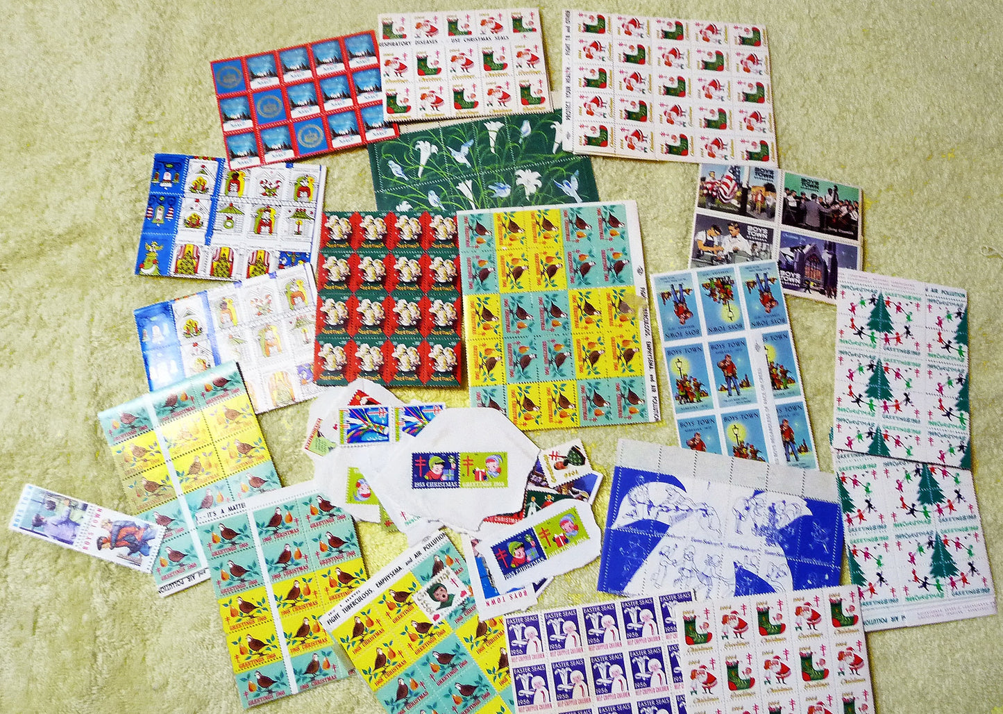17 full sheets of 1960s and 1970s Christmas and Easter seals, Boy's Town seals, and featuring a sheet of 1966 NAACP Christmas seals!