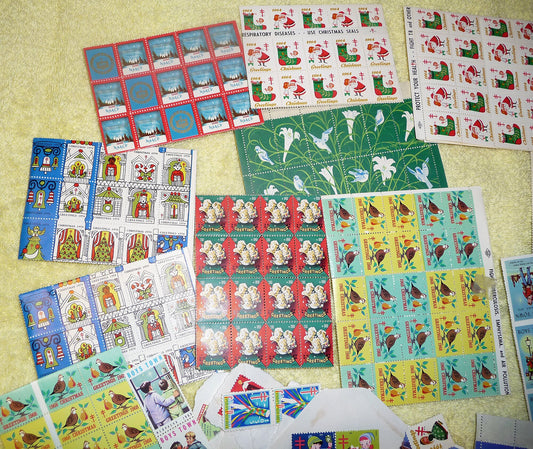 17 full sheets of 1960s and 1970s Christmas and Easter seals, Boy's Town seals, and featuring a sheet of 1966 NAACP Christmas seals!