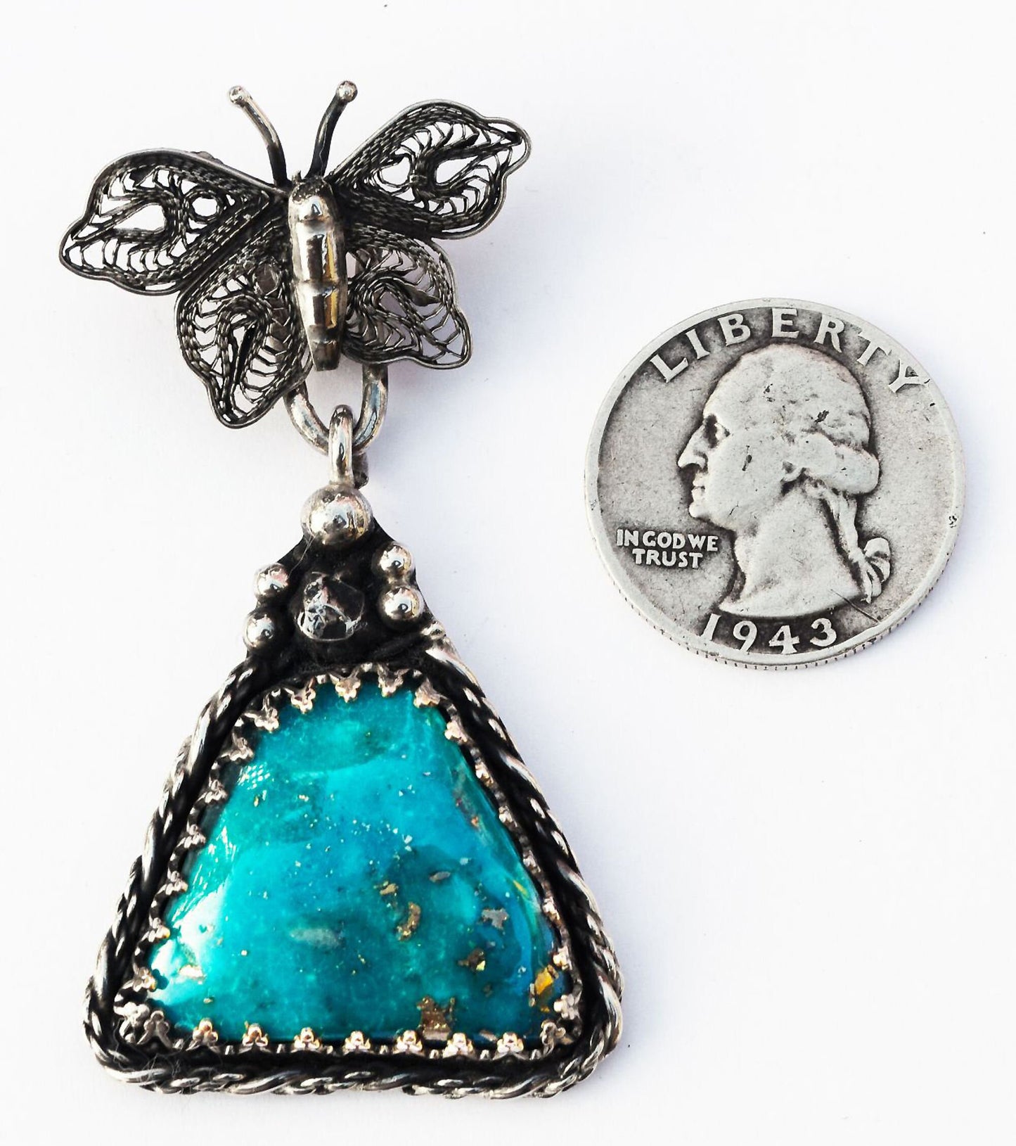 Lovely, handmade, filigreed Sterling Silver butterfly pendant with top color Turquoise.