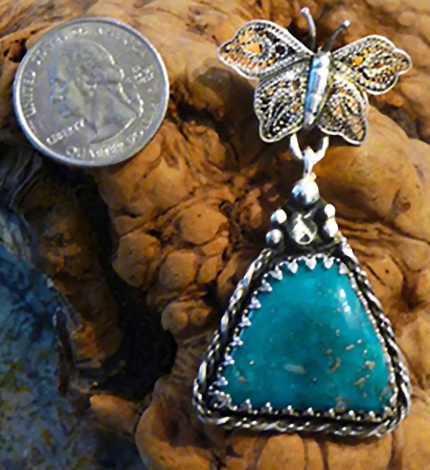 Lovely, handmade, filigreed Sterling Silver butterfly pendant with top color Turquoise.