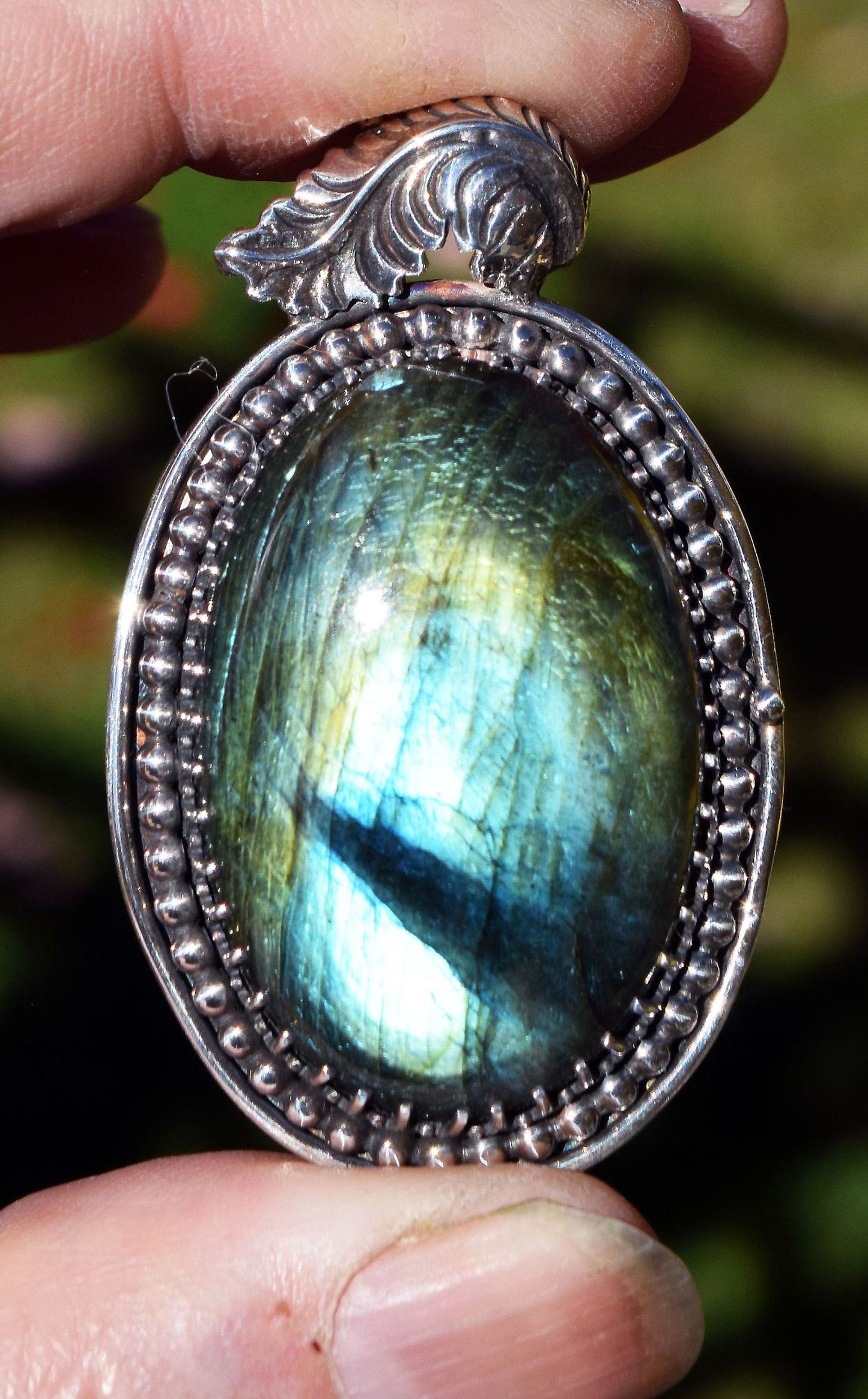 Beautiful Labradorite in a hand-made sterling silver pendant.