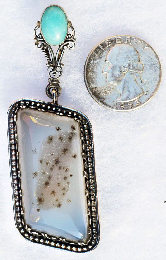 Tiny crystals and black snowflakes in a Sterling Silver pendant