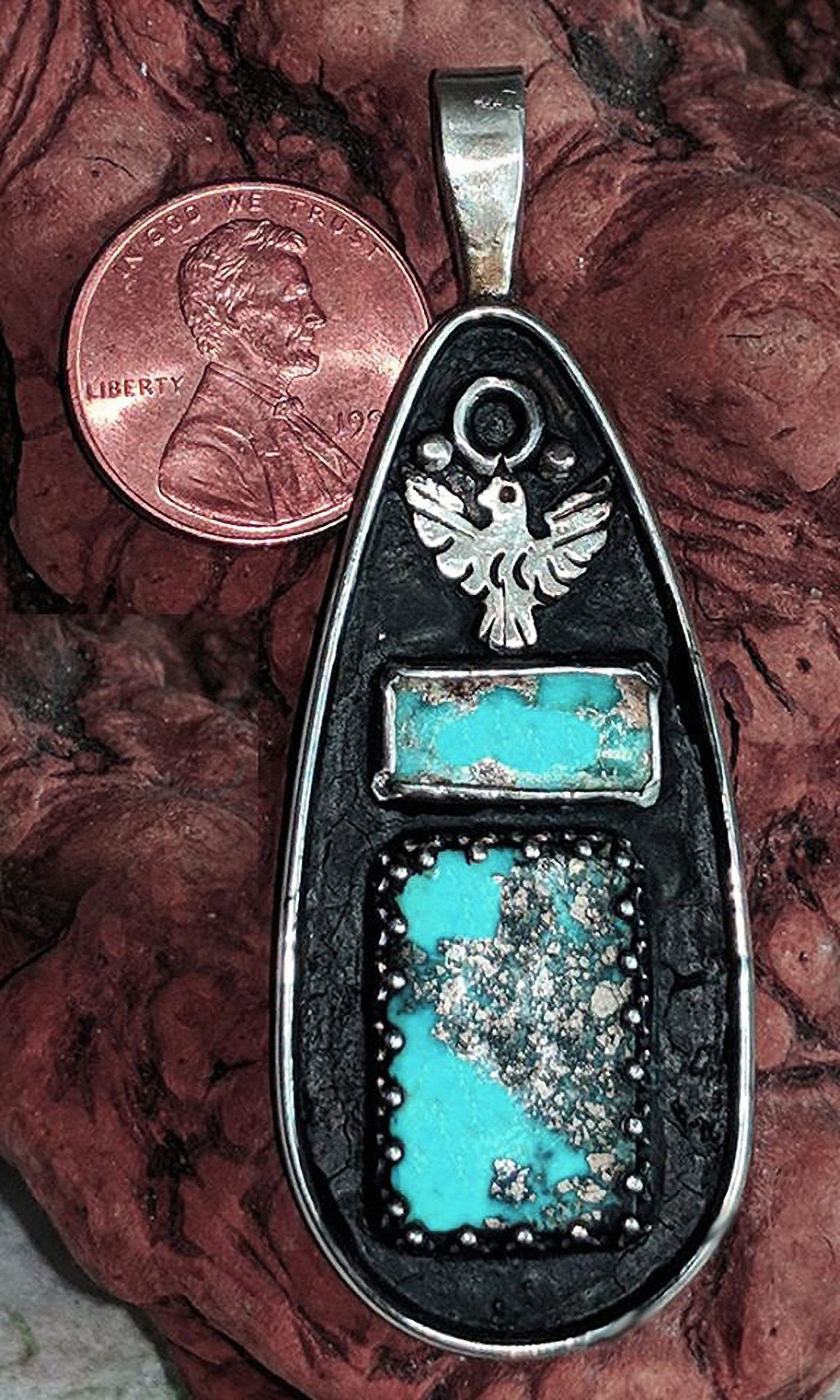 Persian Turquoise in a handmade sterling Silver pendant.