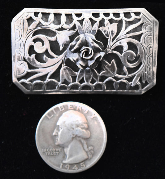1930s Western charm in a vintage sterling silver filigree pin.