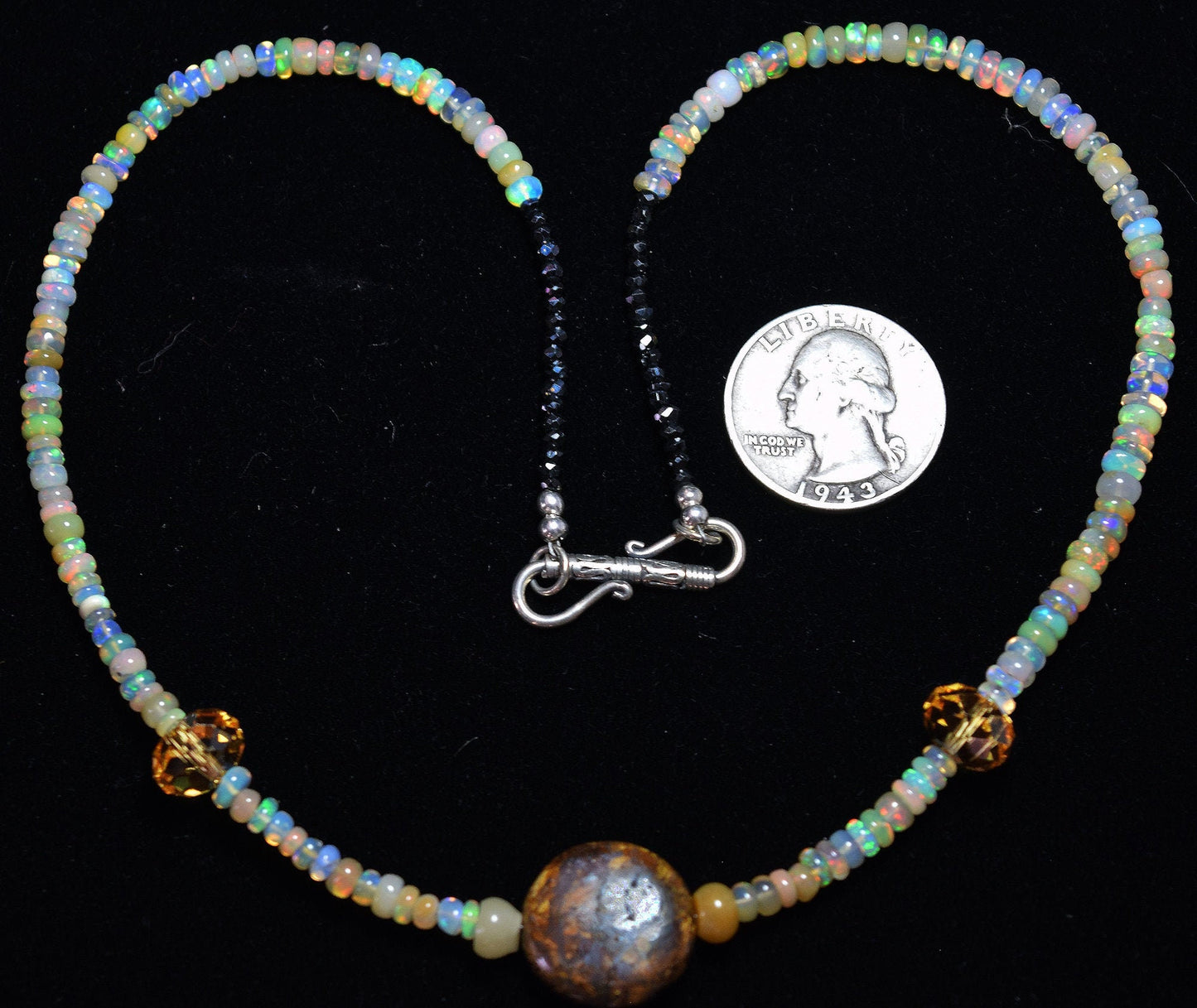 Vibrant and beautiful 18 inch Wello Opal necklace featuring a Bronzite center stone and sterling silver clasp.