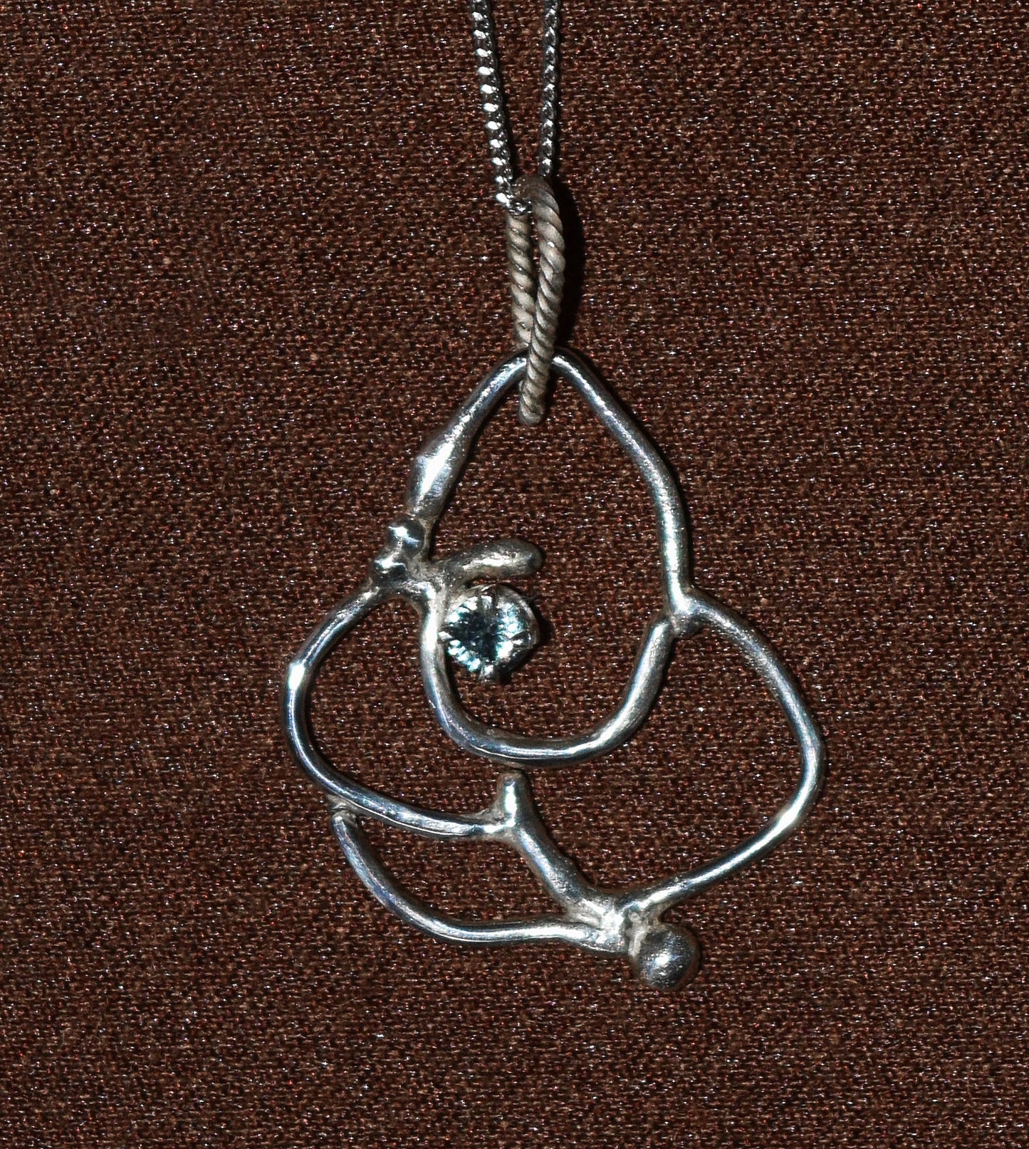 Handcrafted Sterling Silver pendant featuring a Baby-Blue Sapphire.