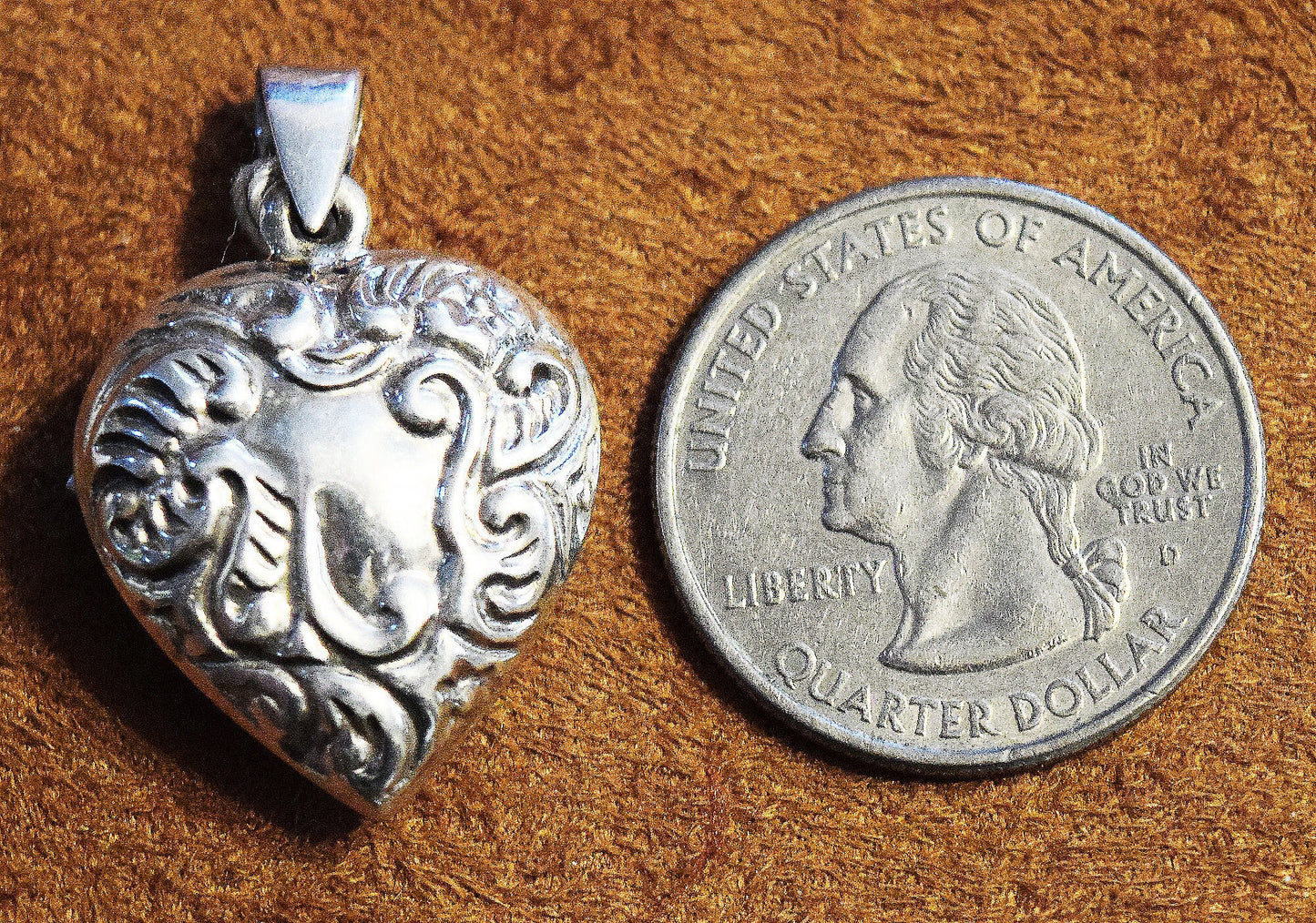 Vintage sterling silver ornate puff heart pendant.