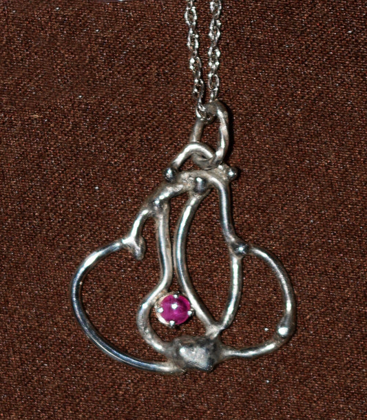 Handcrafted Sterling Silver pendant featuring a Burmese Ruby gemstone.