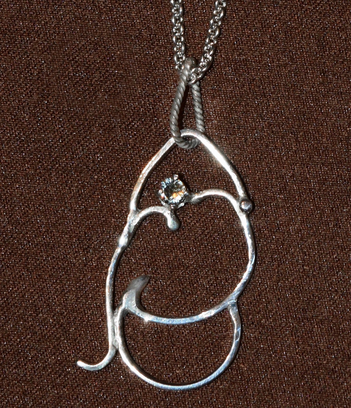 Handcrafted Sterling Silver pendant featuring a rare, polychrome Tanzanian Sapphire. Includes a 18-inch Sterling necklace.