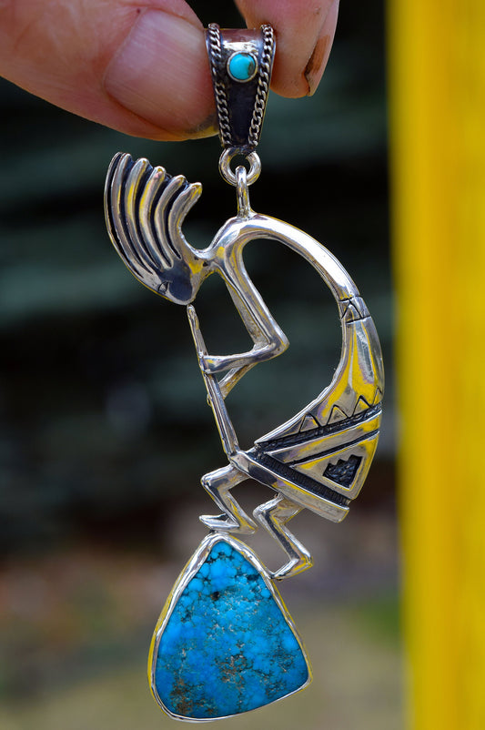 Kokopelli dances to the top of Turquoise Mountain! Featuring a 15.3 carat, natural, untreated, Sleeping Beauty Turquoise Gem!