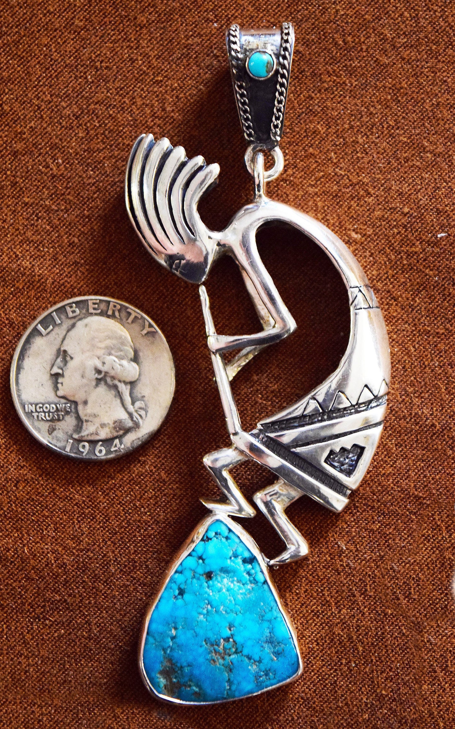 Kokopelli dances to the top of Turquoise Mountain! Featuring a 15.3 carat, natural, untreated, Sleeping Beauty Turquoise Gem!