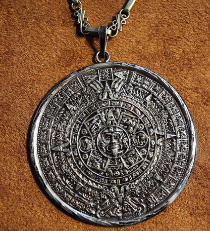 Double-sided Sterling Silver Mayan Calendar pendant on a 26 inch handmade ornate silver chain.