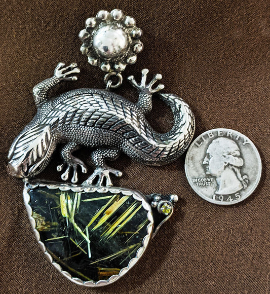 A large lazy lizard languishes under the summer?s desert sun. Sterling pendant with Rutilated Quartz by Mani Pureheart!