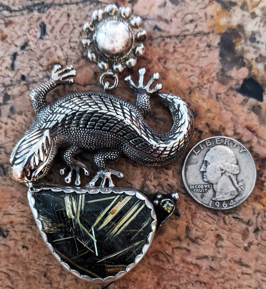 A large lazy lizard languishes under the summer?s desert sun. Sterling pendant with Rutilated Quartz by Mani Pureheart!