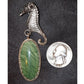 A serene seahorse hovers near what looks like seagrass captured in a stone. Featuring rare  ?Mexican Imperial Jasper?.